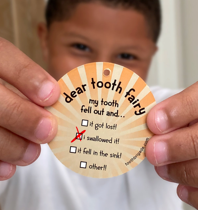 boy with substitooth for lost tooth for when you can't find your tooth